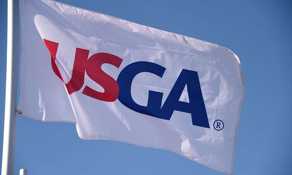 Jun 17, 2015; University Place, WA, USA; USGA flags on top of the first hole grandstand during practice rounds on Wednesday at Chambers Bay. Mandatory Credit: Michael Madrid-USA TODAY Sports