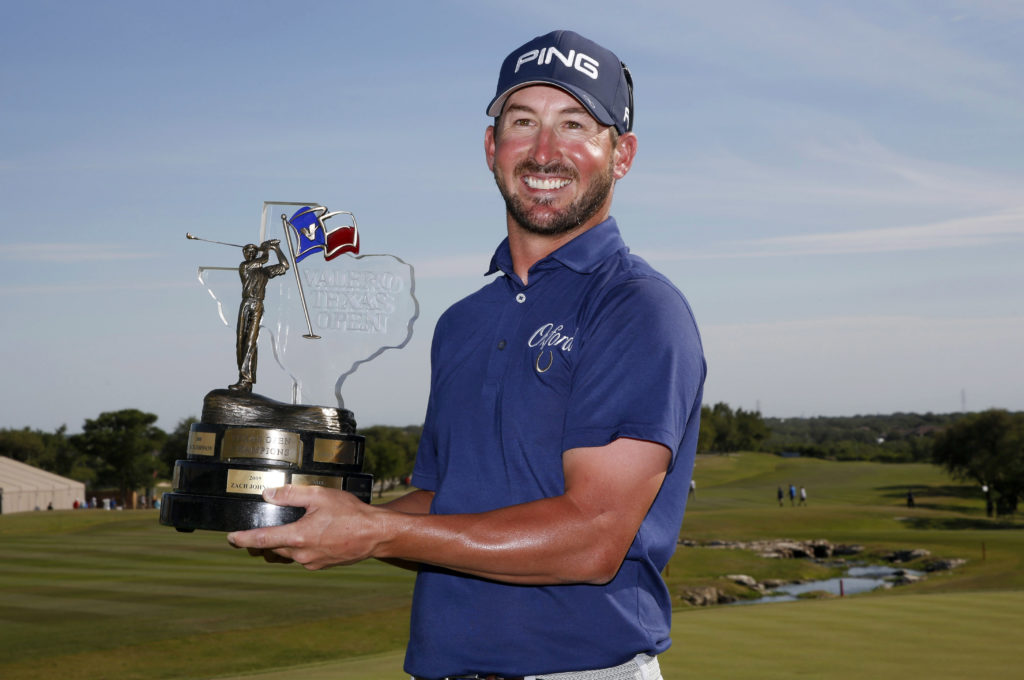 Apr 22, 2018; San Antonio, TX, USA; Andrew Landry celebrates with the trophy after the final round of the Valero Texas Open golf tournament at TPC San Antonio - AT&T Oaks Course. Mandatory Credit: Soobum Im-USA TODAY Sports